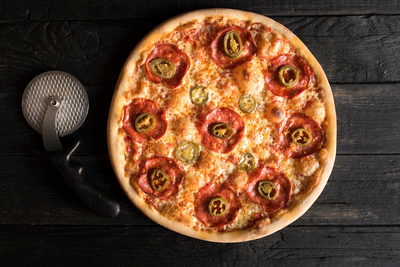 Pepperoni imos pizza with extra toppings on thin crust